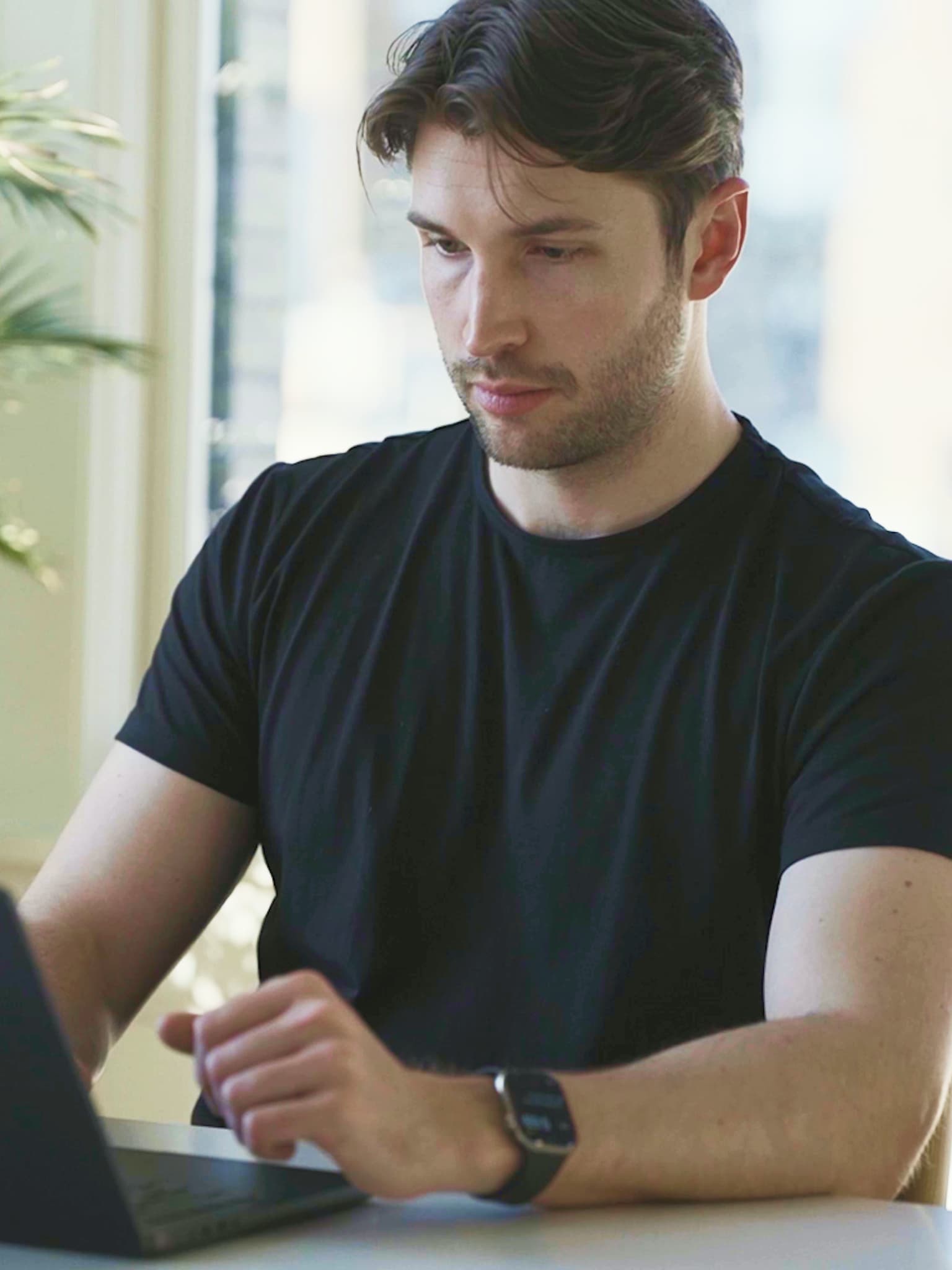 Greg working on a computer